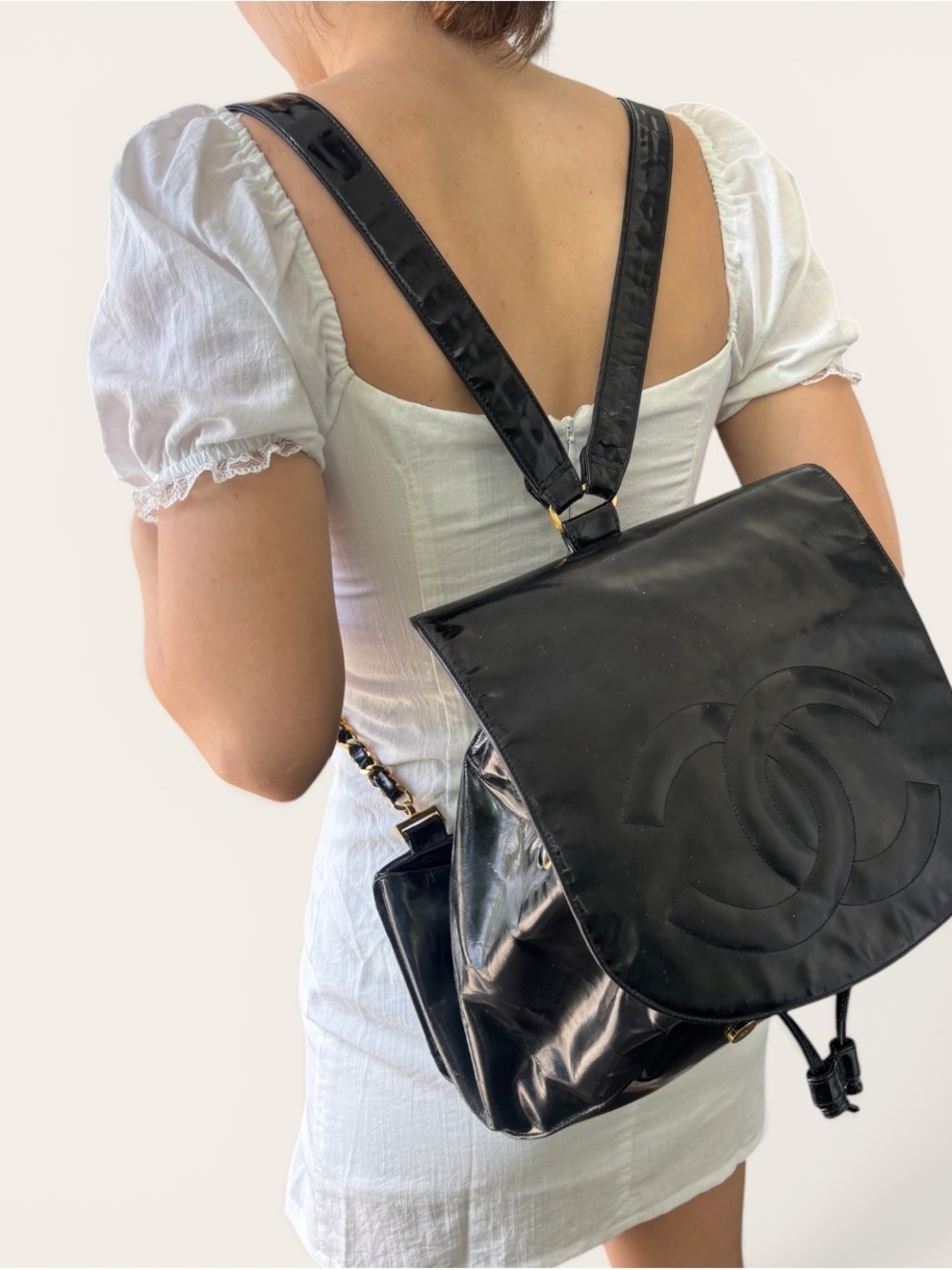 Vintage black patent leather Chanel Coco Mark backpack